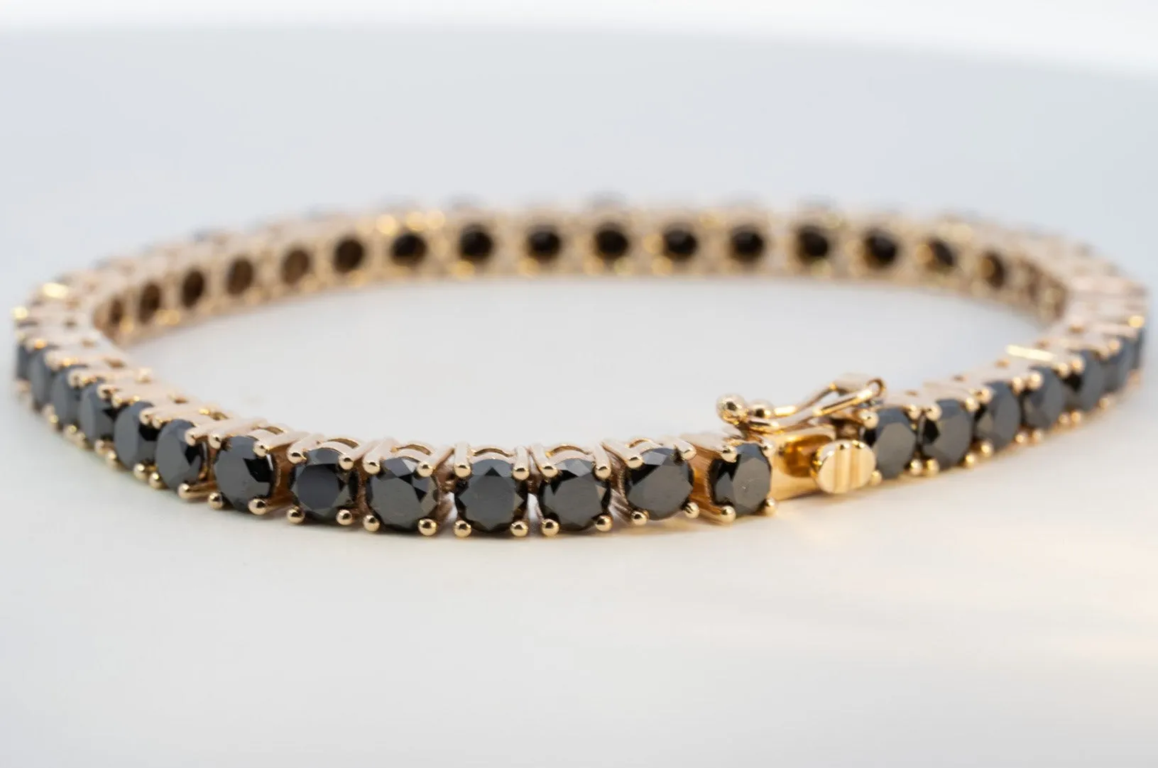 "Valentine's Sparkle: 10K Gold Black Diamond Tennis Bracelet"